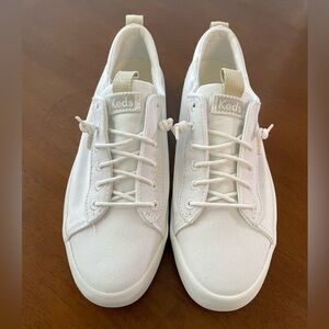 Keds white slip ons. Never worn size 6 white